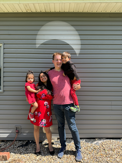 Standing in front of a projection of the total solar eclipse